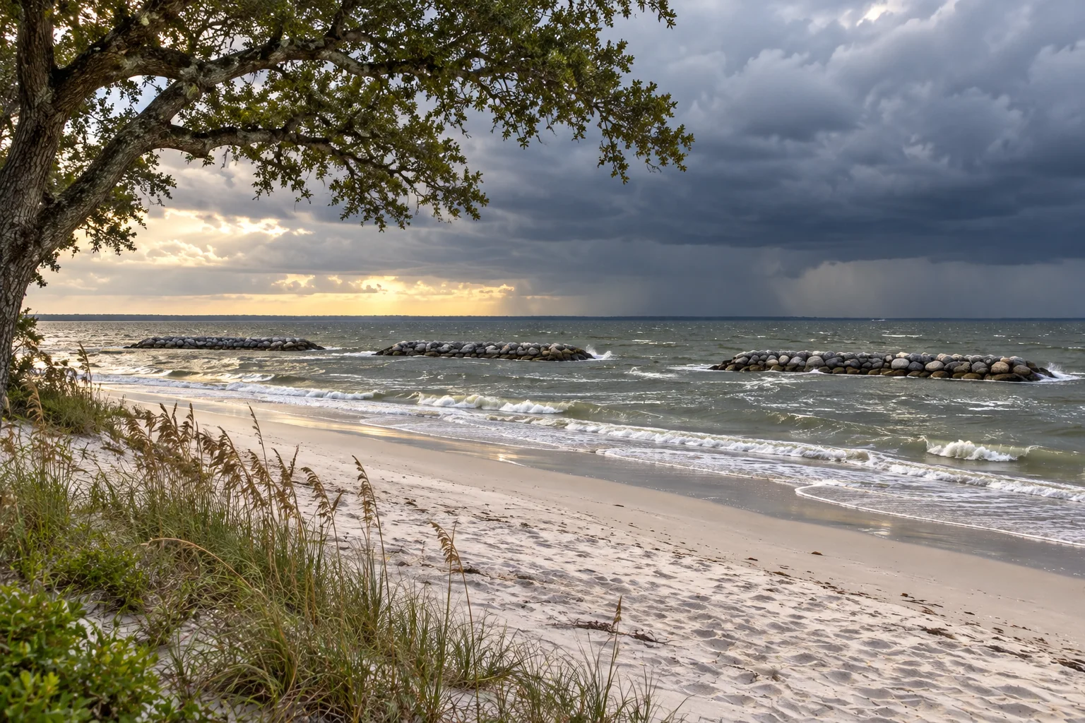 Storm clouds approaching the restored Magnolia Beach shoreline and its three offshore rock breakwaters